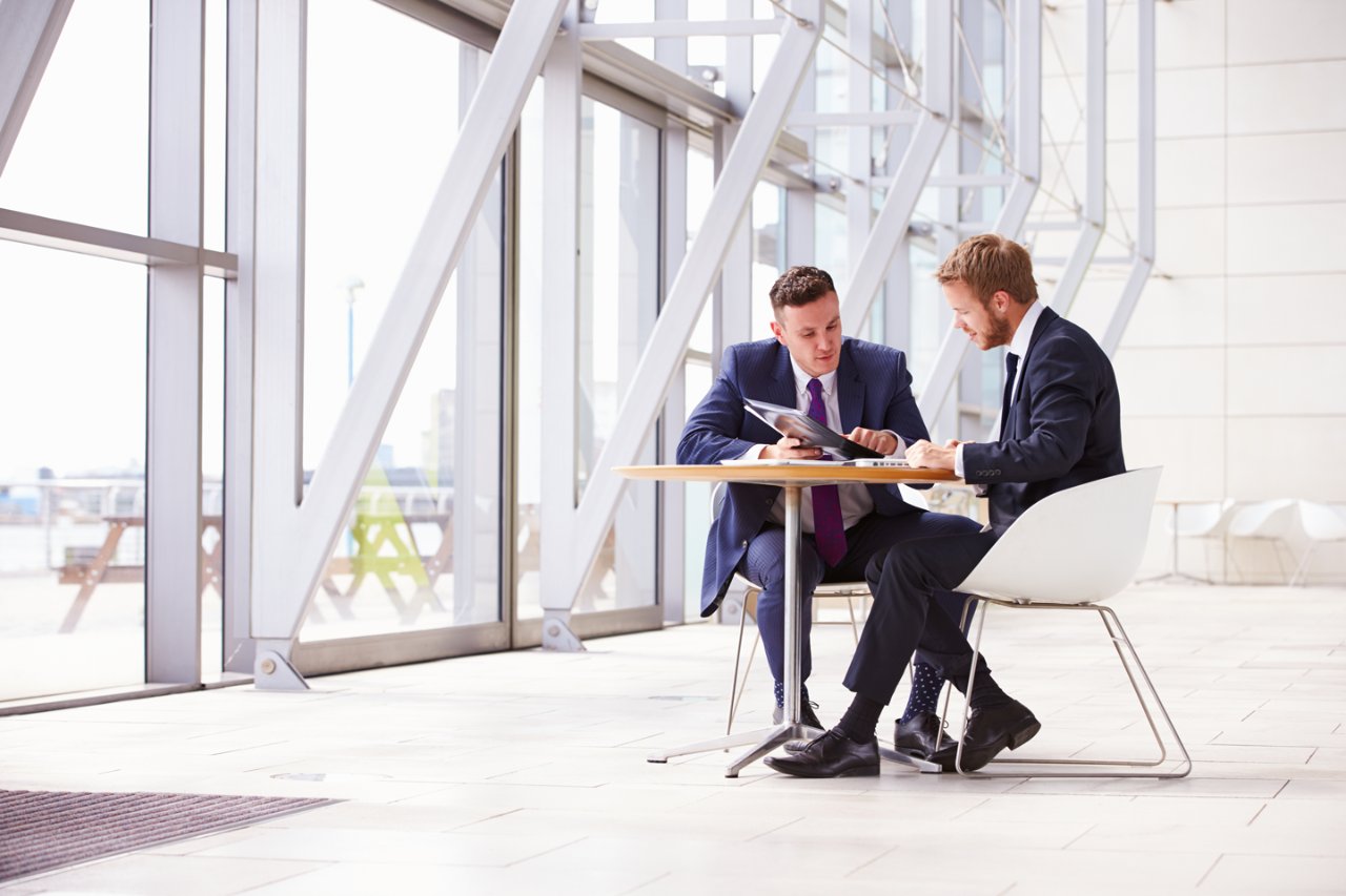 two businessmen working in modern office