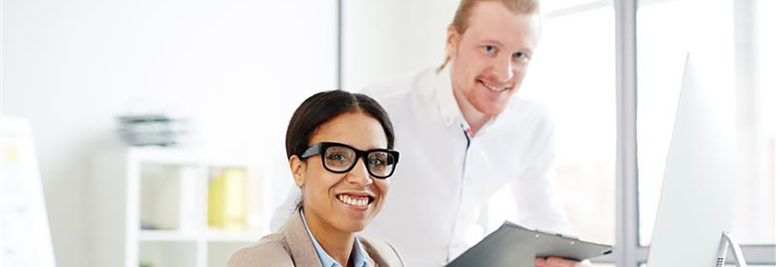 Two people working at office