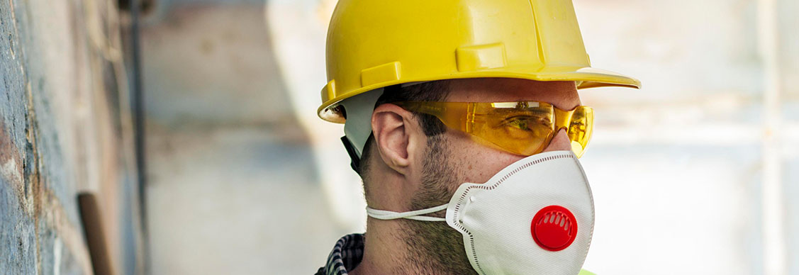 Front view worker with protective mask hard hat