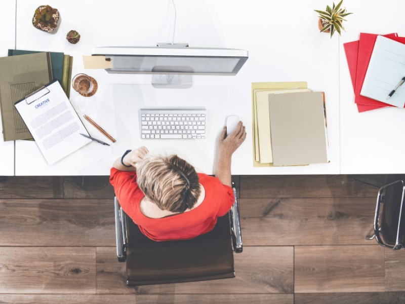 Top view shot of a man working on a desktop