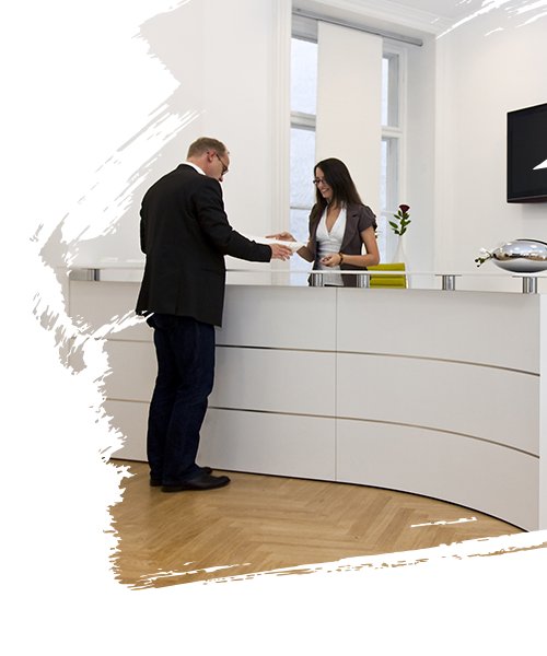 Front desk lady communicating with client in the office reception area