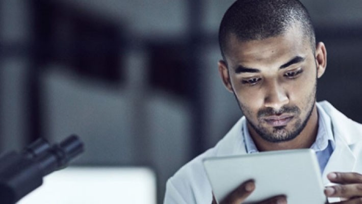 Picture of an employee using his tablet