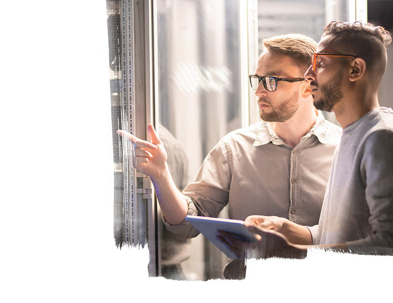 Two people in a server room