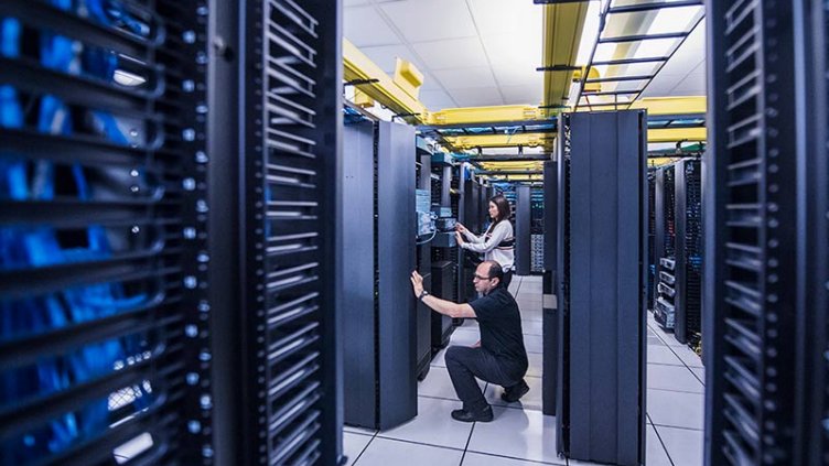 Data center workers providing routine server maintenance