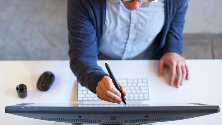 Person is writing something on screen