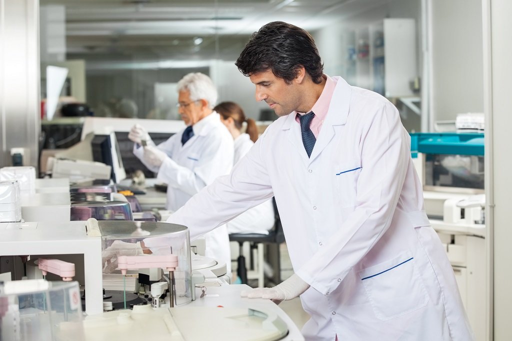 Mid adult male technician experimenting in laboratory using centrifuge; Shutterstock ID 226408627; Departmental Cost Code : 162800; Project Code: GBLMKT; PO Number: GBLMKT; Other: 