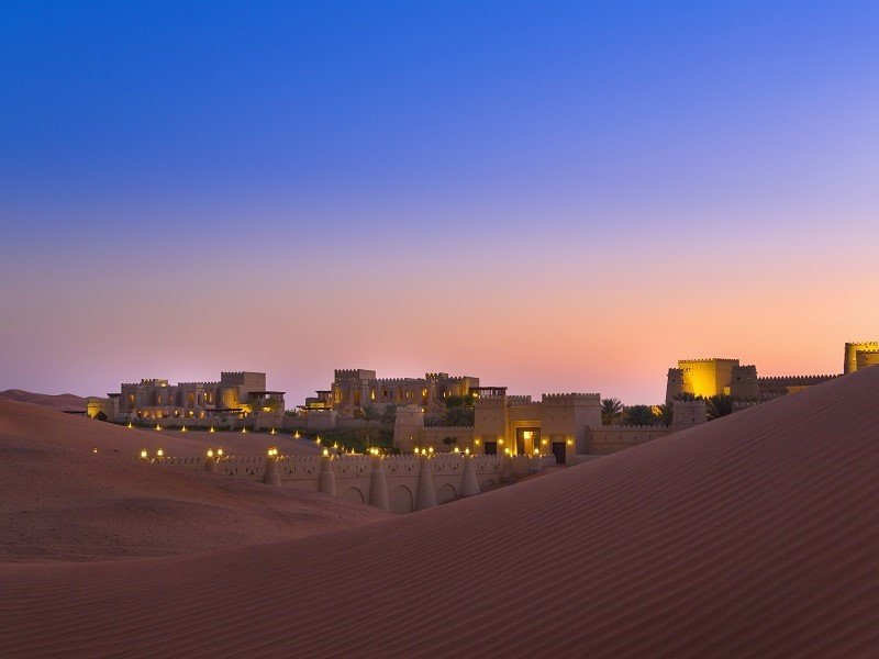 royal palace in the middle of sand dunes 