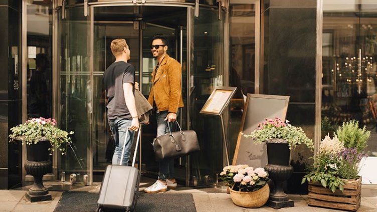 Men talking at the entrance of a hotel