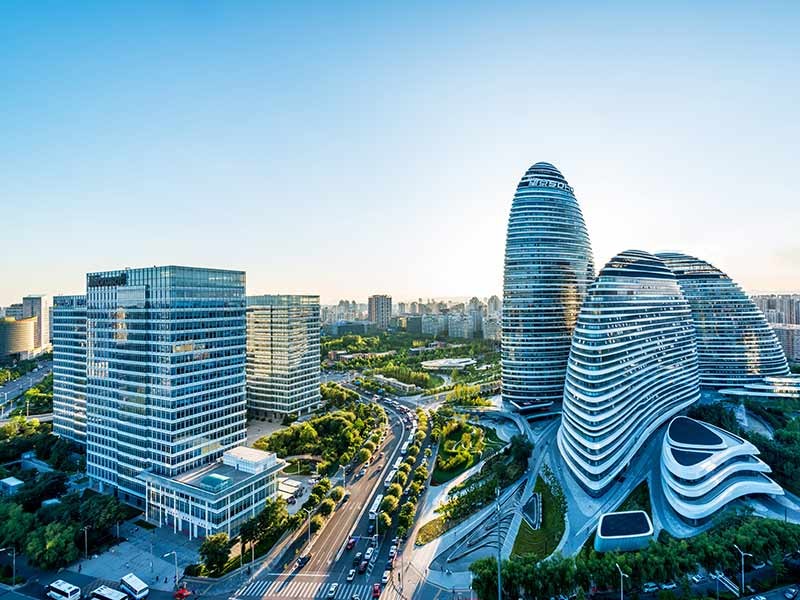 Top view of high rise glass office buildings in a smart city