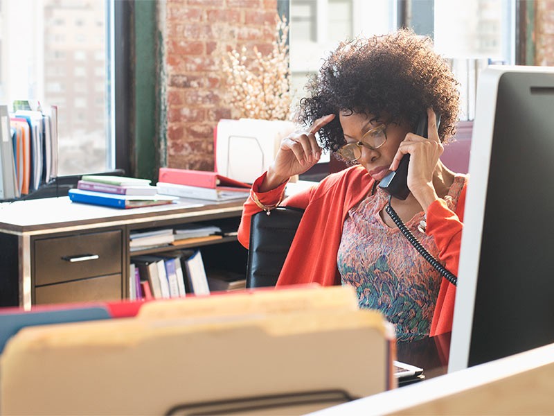 Woman talking on a telephone