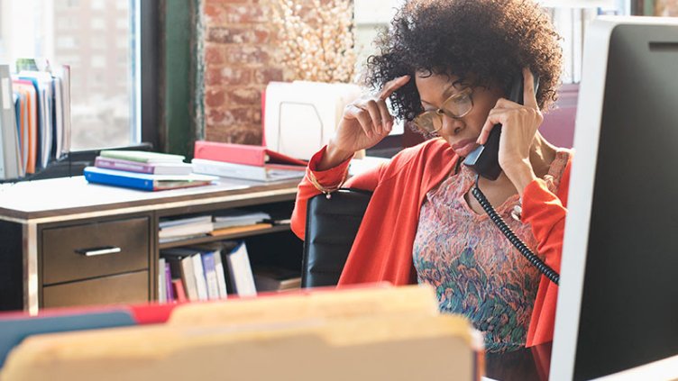 Woman talking on a telephone