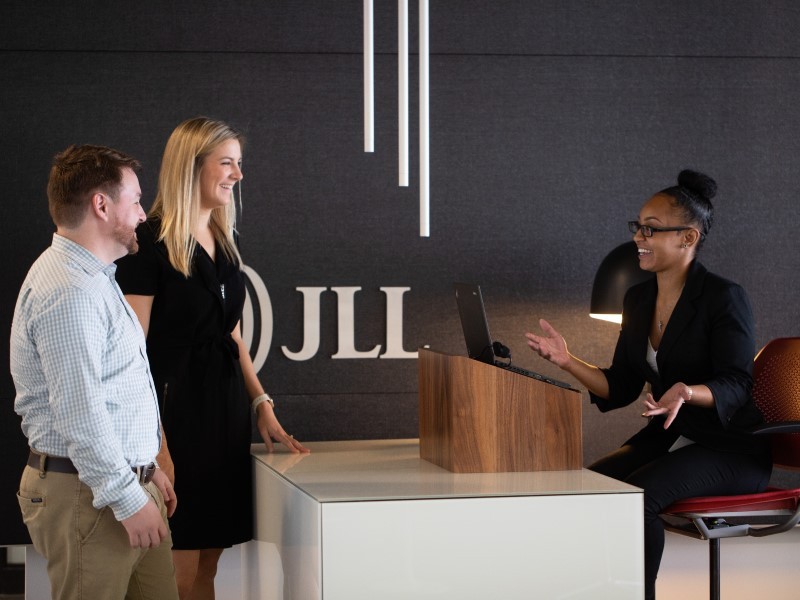 Three people at JLL office