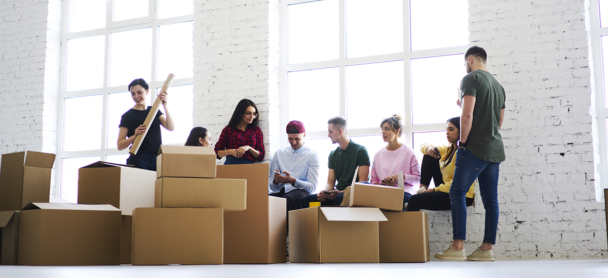 workers unpack moving boxes