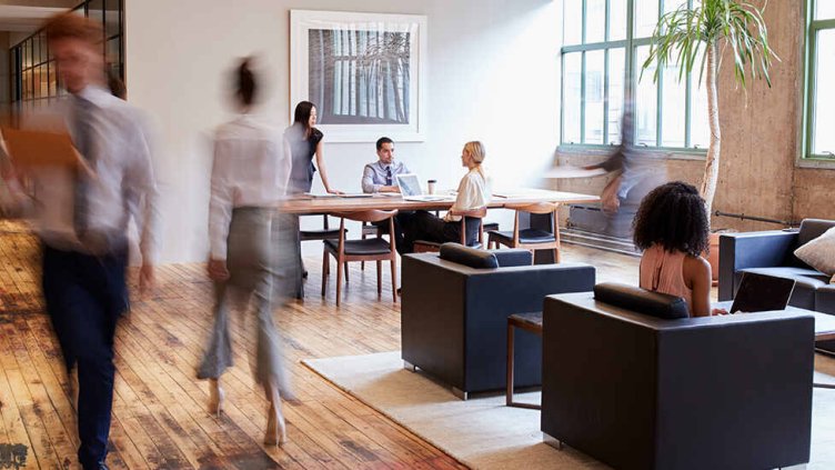 People working inside the real estate office building