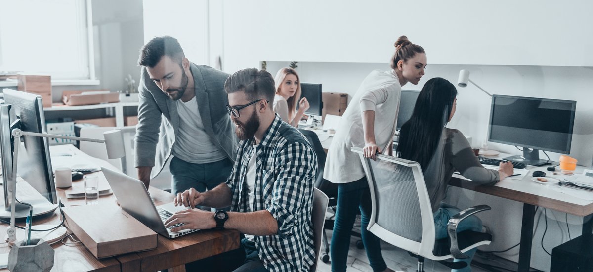 workers collaborating in tech office