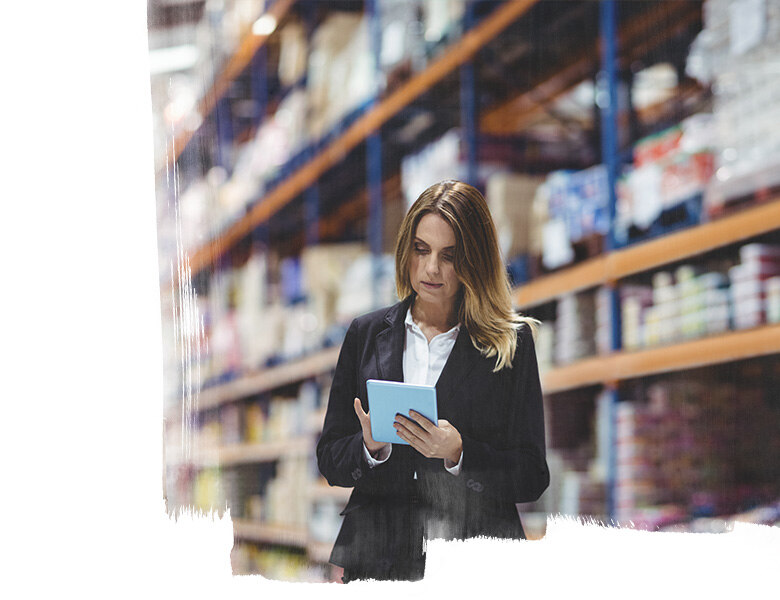 Employee of logistic warehouse using digital tablet for checking the stock