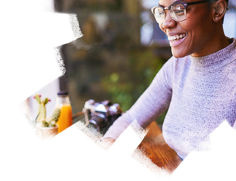 Smiling woman working on laptop