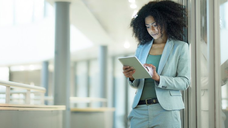 An employee using her tablet inside the office premises